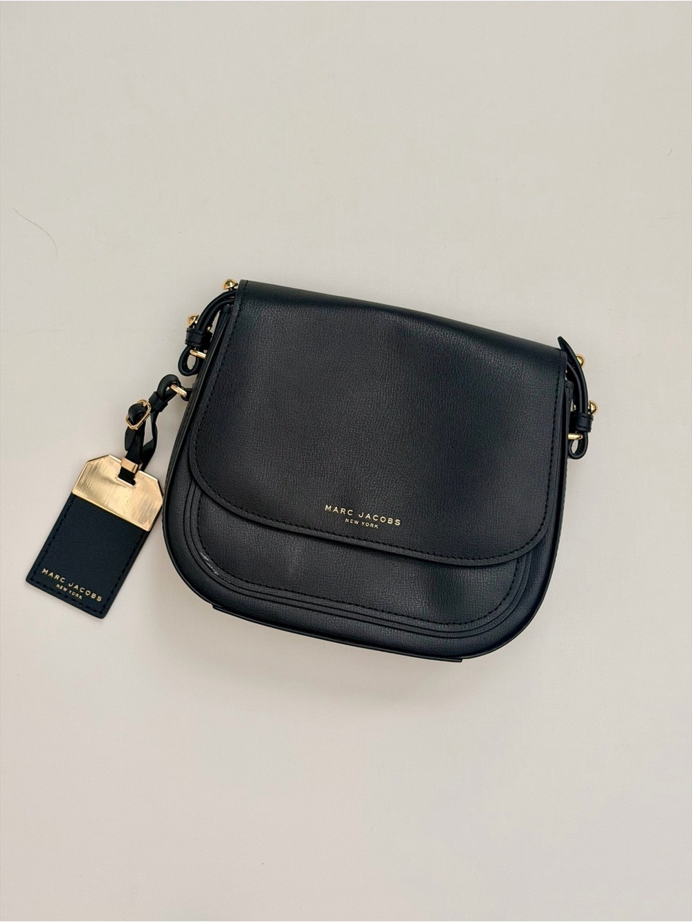 Marc Jacobs Mini Rider Leather Crossbody Bag in black.